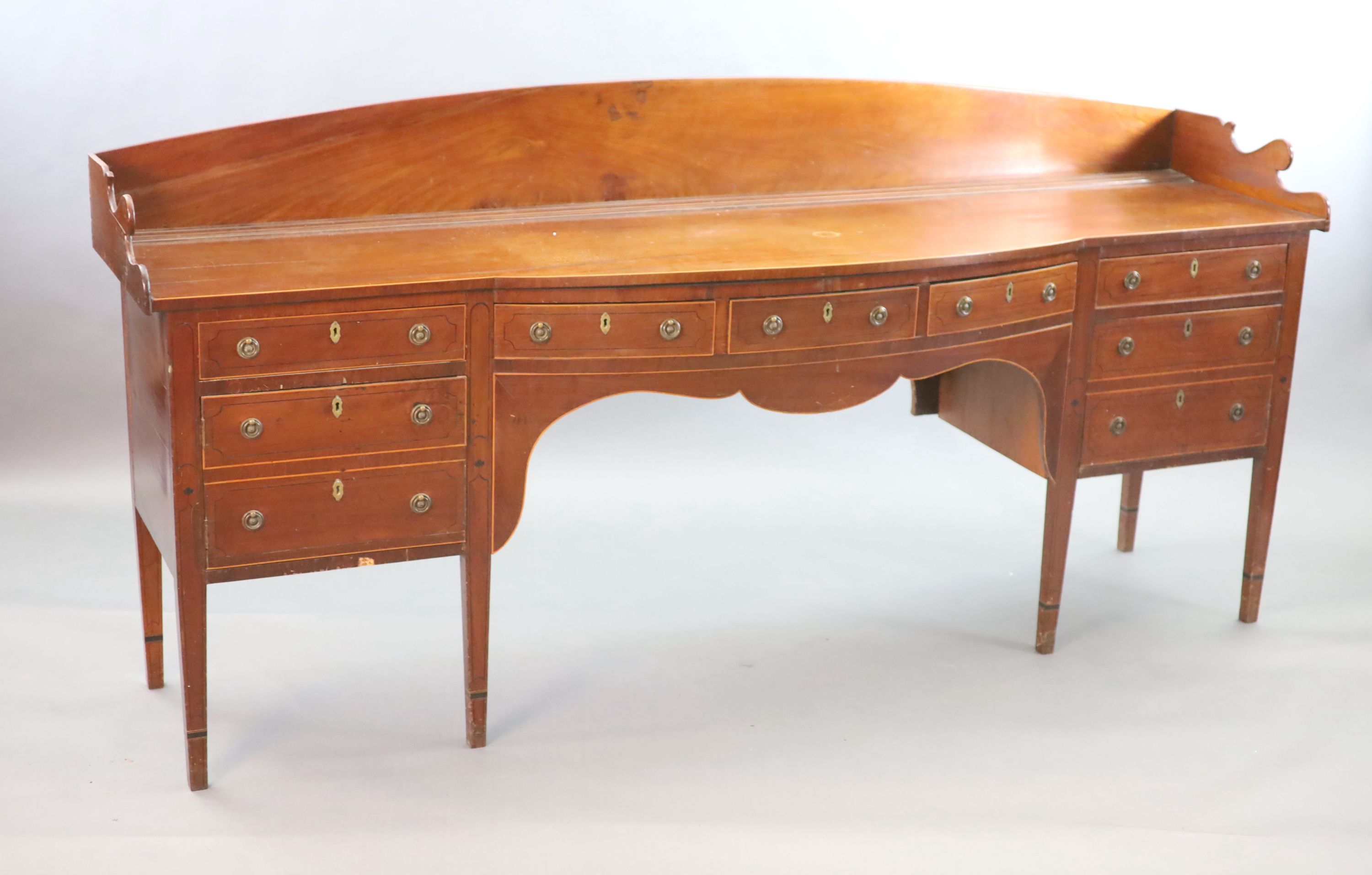 A Regency boxwood strung mahogany bowfront sideboard, W.241cm D.63cm H.118cm